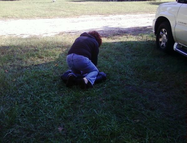 Mary rolling up tent